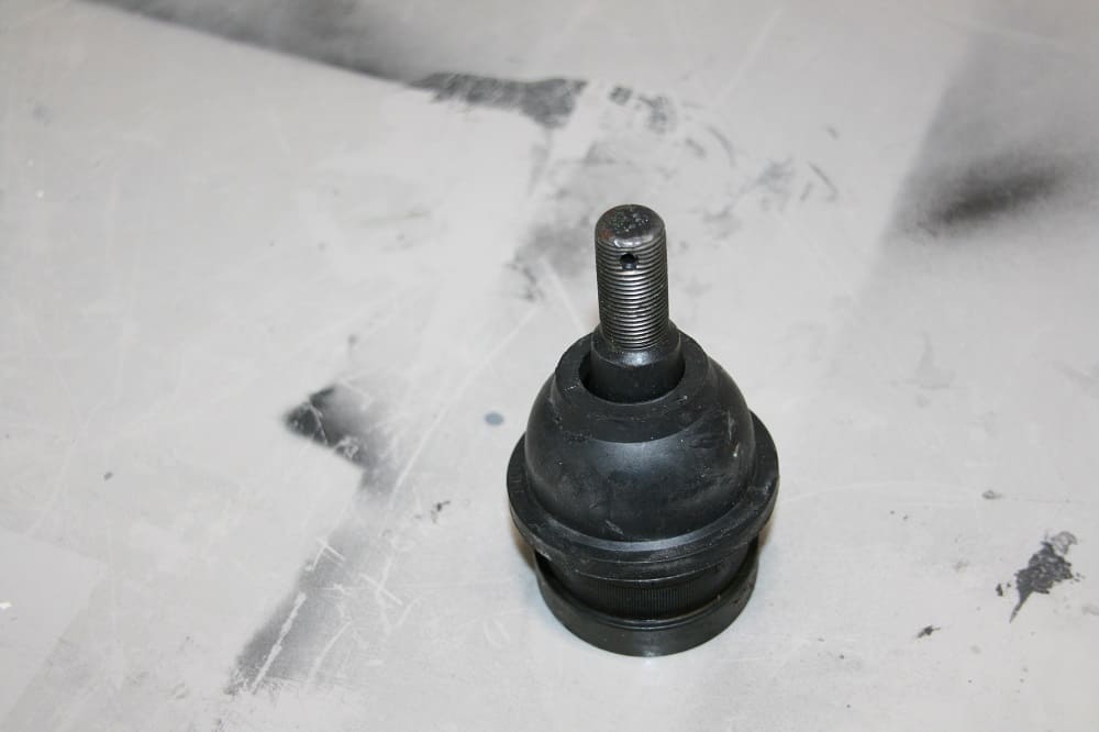 A new ball joint complete with a new dust cover.